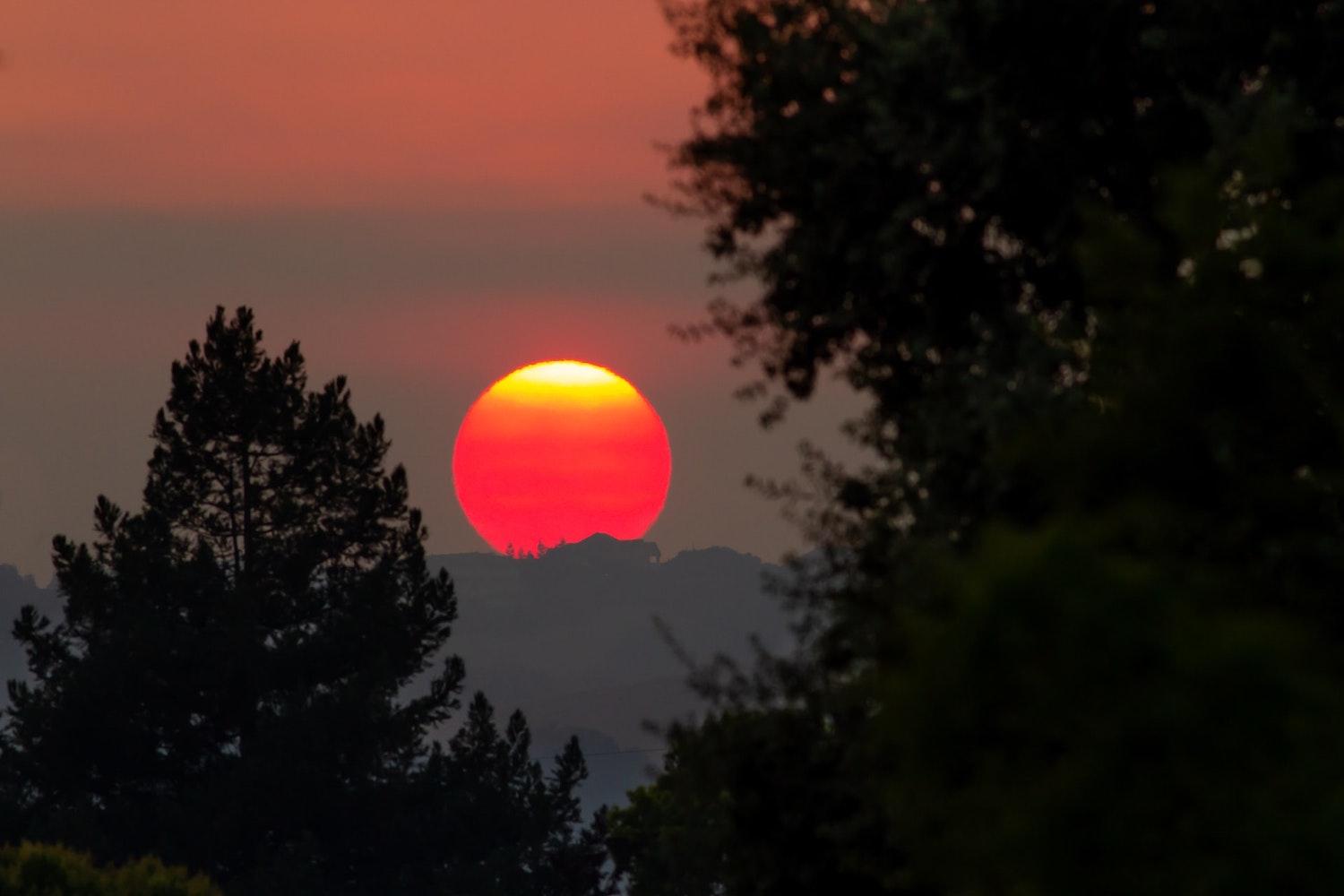 california wildfires glowing sunset climate change ipcc report